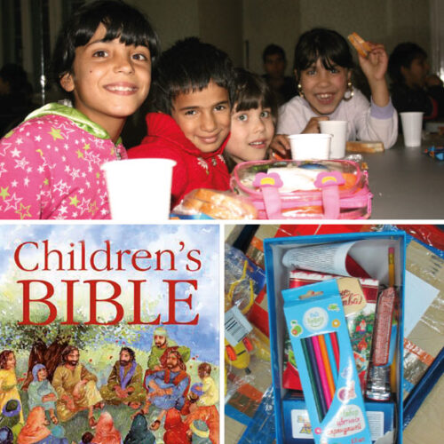 Happy children, Bible and gift