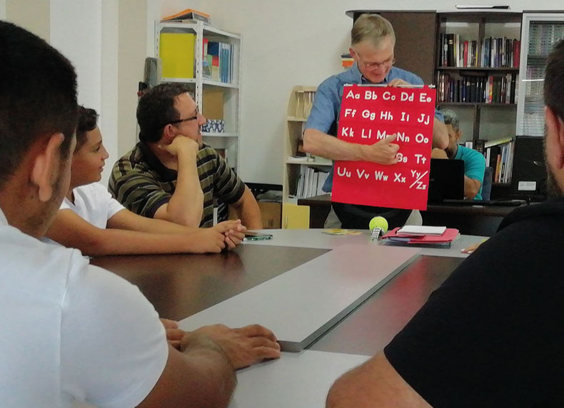 Graham Owen takes students through the English alphabet.