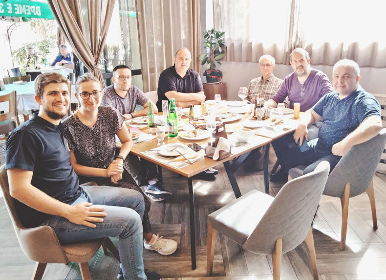 Mile, Katerina, Ivan, Robert, Michael, Ken & Petre enjoying a hot meal in Stip