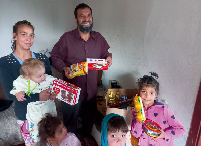 A family helped with food in Radovis, North Macedonia
