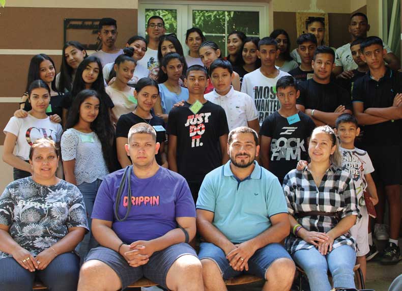 Pg 6. Danijel and Alexandra Reckovic with young people and leaders