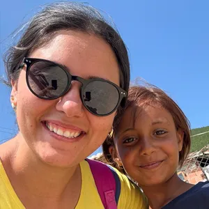 Youth worker and child smiling