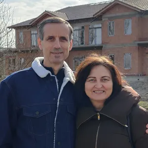 Dan and Marinela Rotariu in front of the new hospice centre development