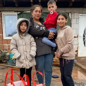 A family with their food parcels in North Macedonia