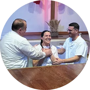 Pastor Artur Krasniqi and Arton baptise a young believer